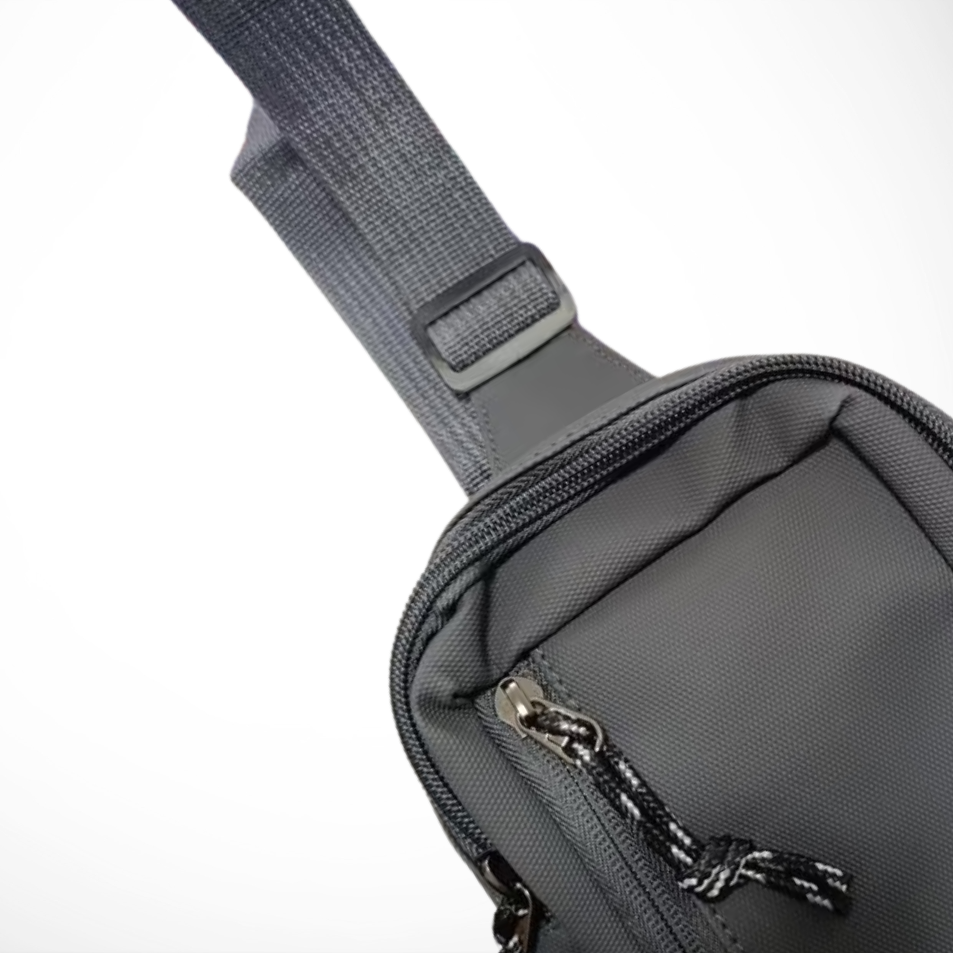 Gray crossbody bag with a strap on a white background