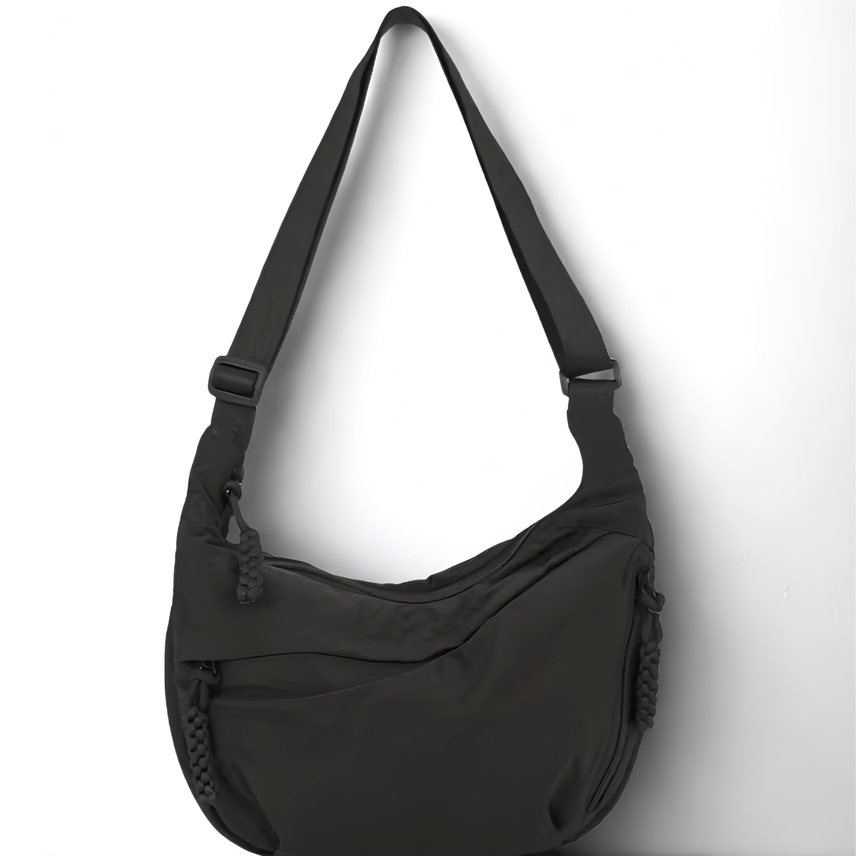 Black shoulder bag on a white background