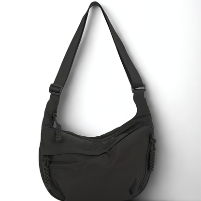 Black shoulder bag on a white background