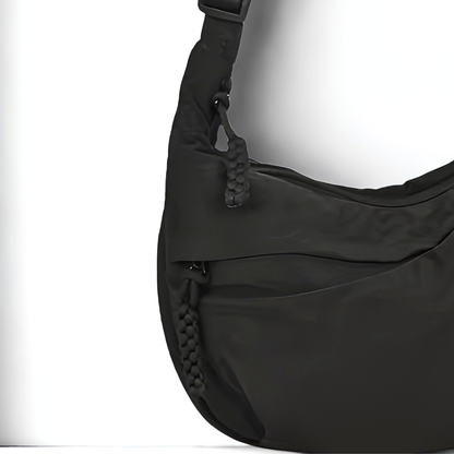 Black shoulder bag on a white background