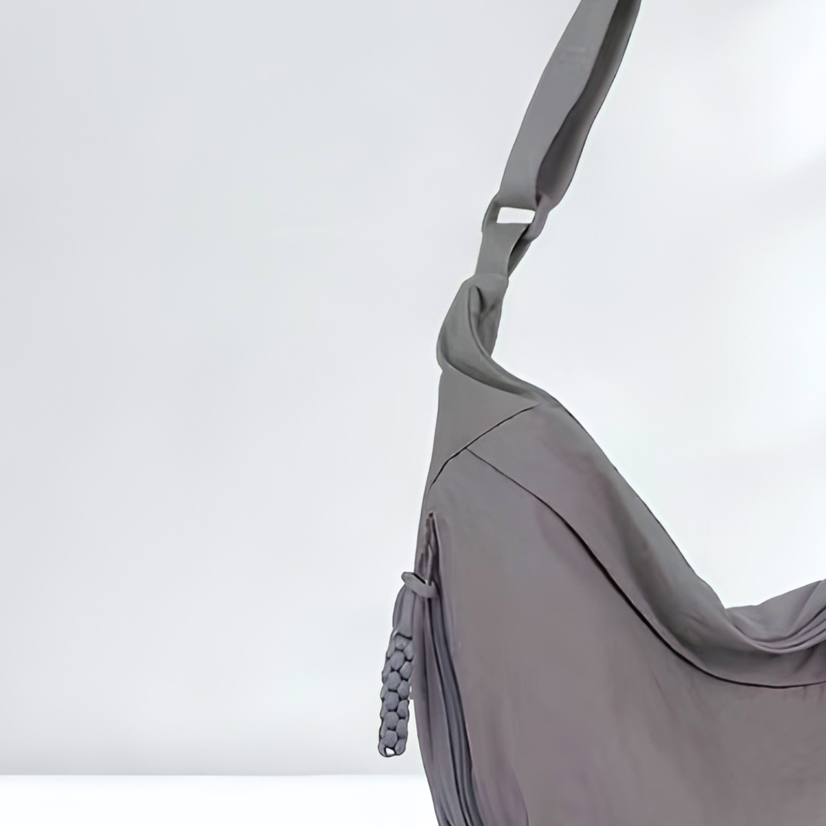 Gray shoulder bag detail shot of zipper