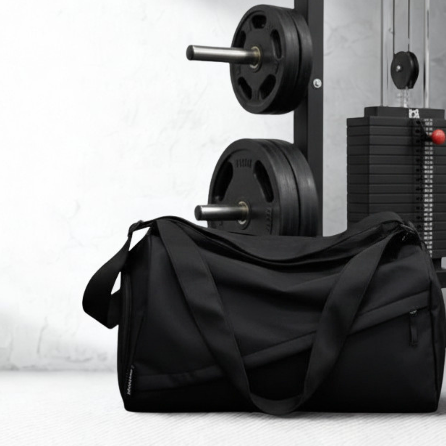 black duffel bag on gym floor