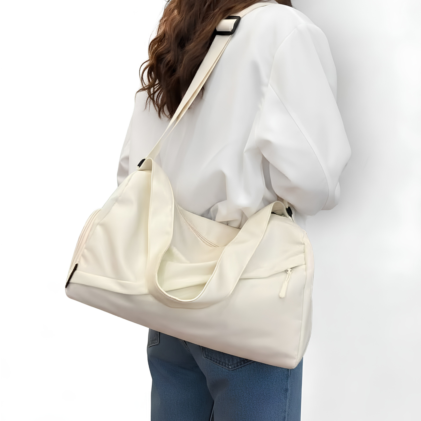 Cream duffel bag on girls shoulder ready to go on weekend trip