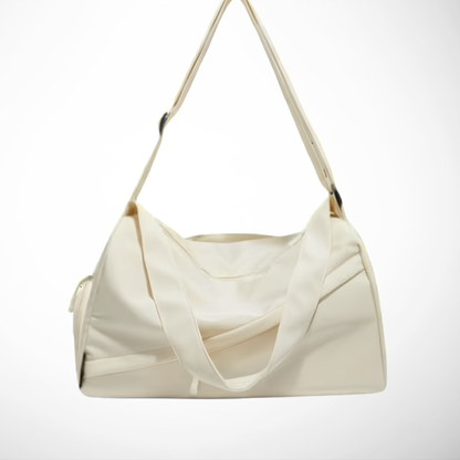 White duffel bag/gym bag
 with a strap on a white background